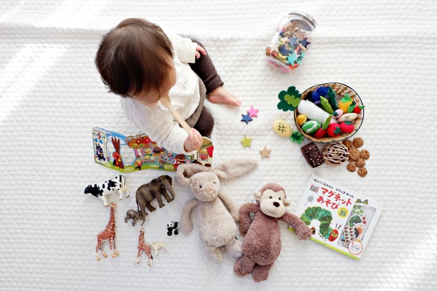 baby with many toys